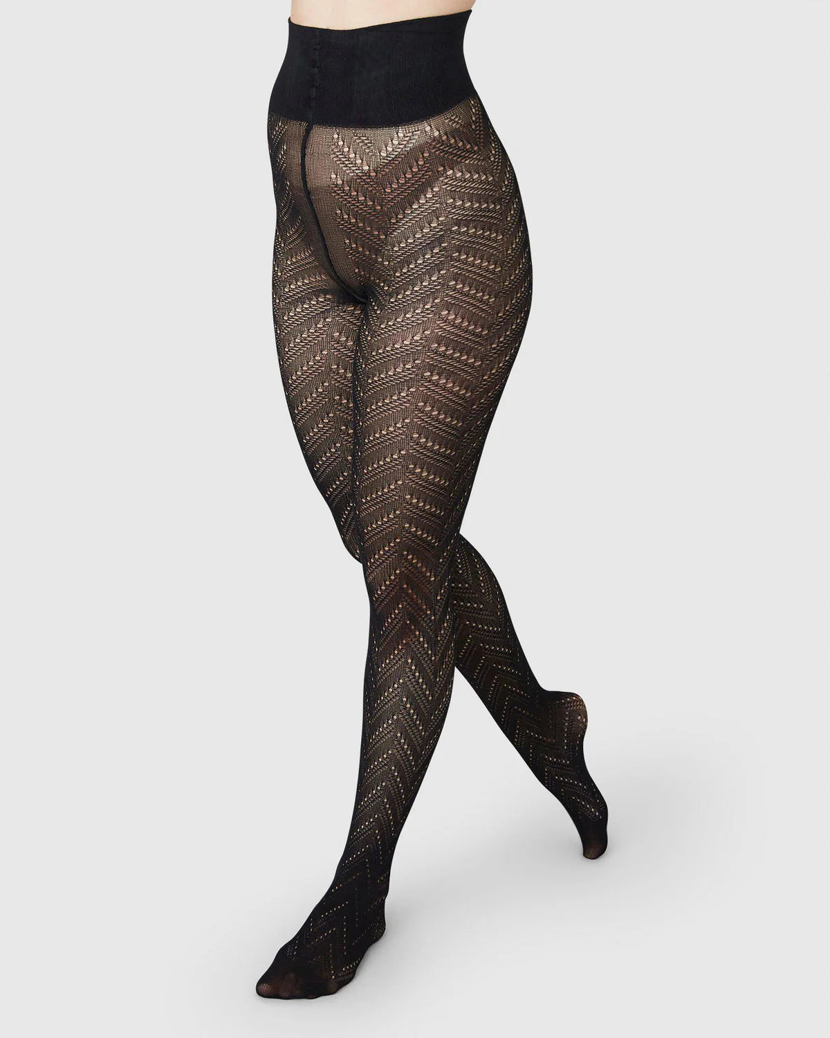 Ina strømpebukser med hul-mønster i sort toej Swedish Stockings 