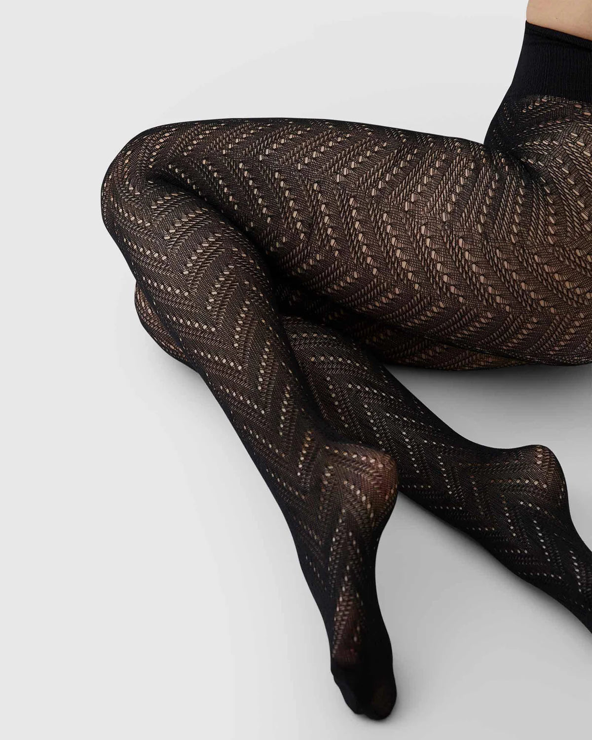 Ina strømpebukser med hul-mønster i sort toej Swedish Stockings 